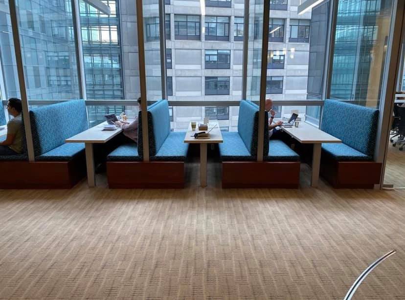 Office café booths upholstered by Melmar in patterned blue fabric