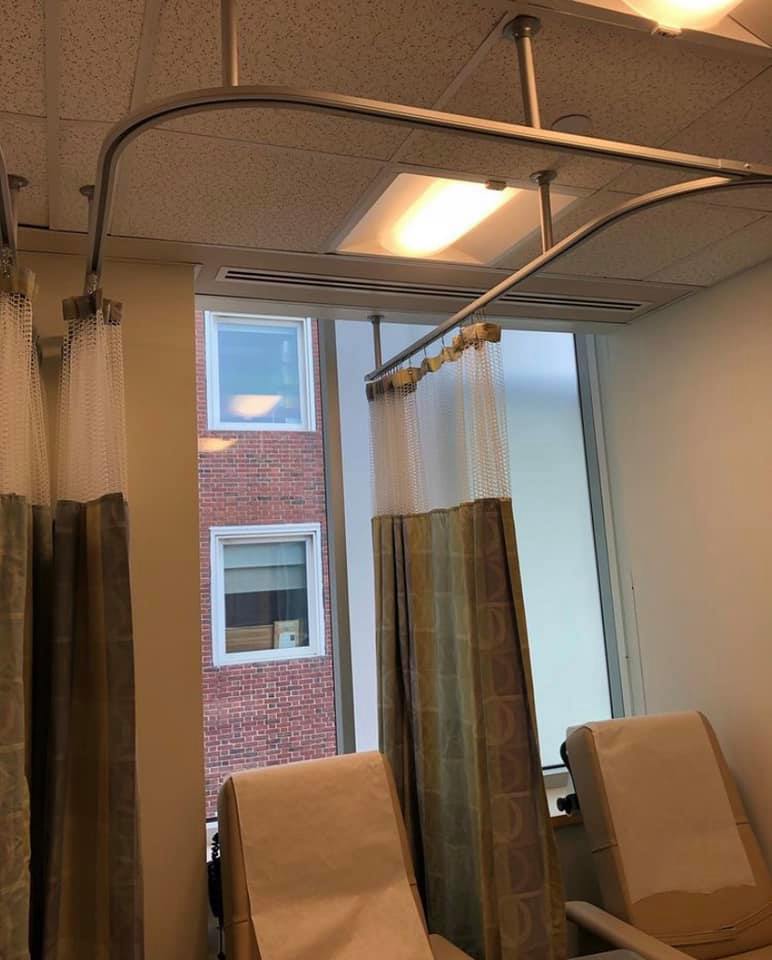 Melmar cubicle curtains and ceiling track in a clinical exam bay