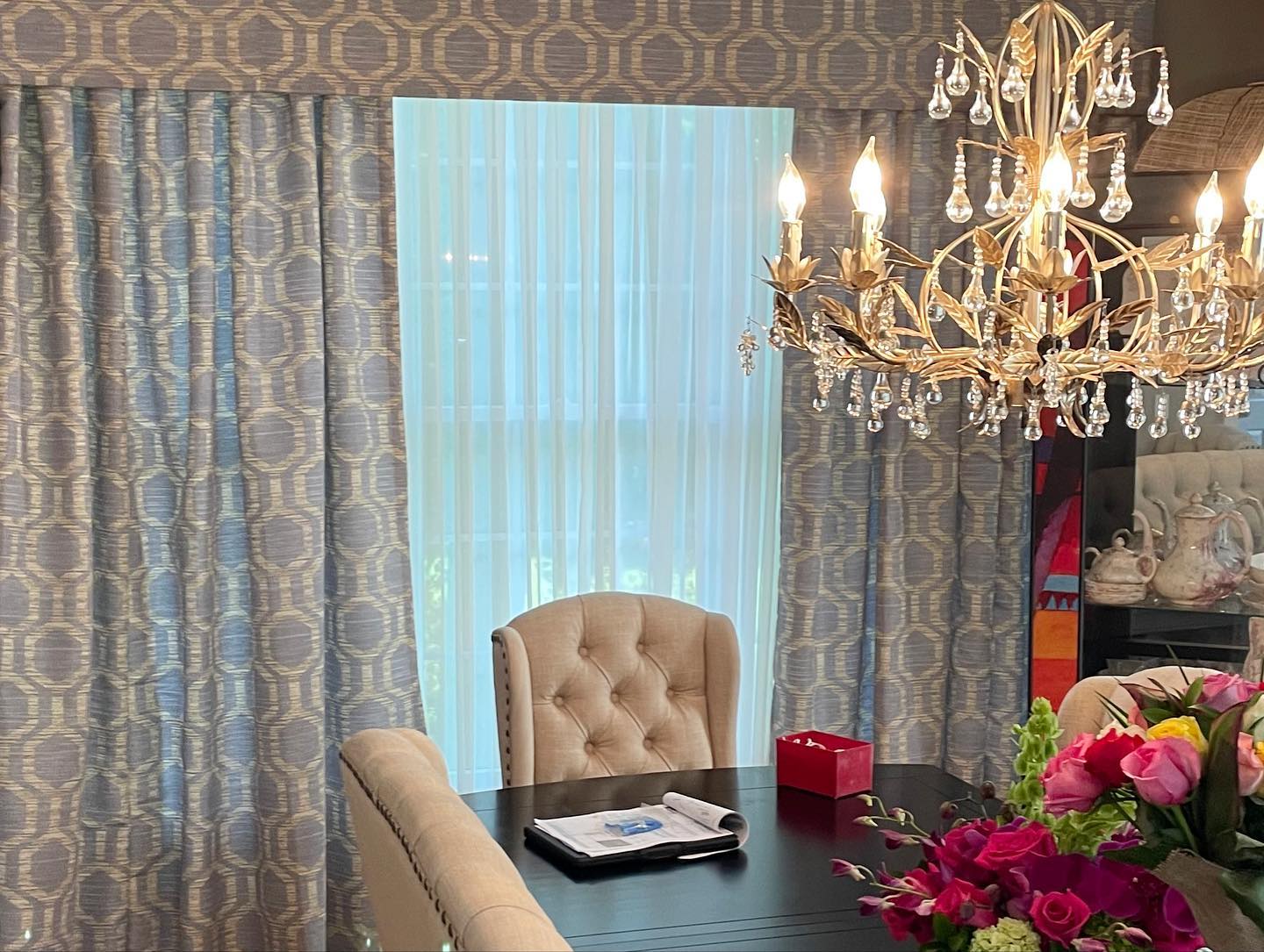 Custom drapery and upholstered cornice in a dining room